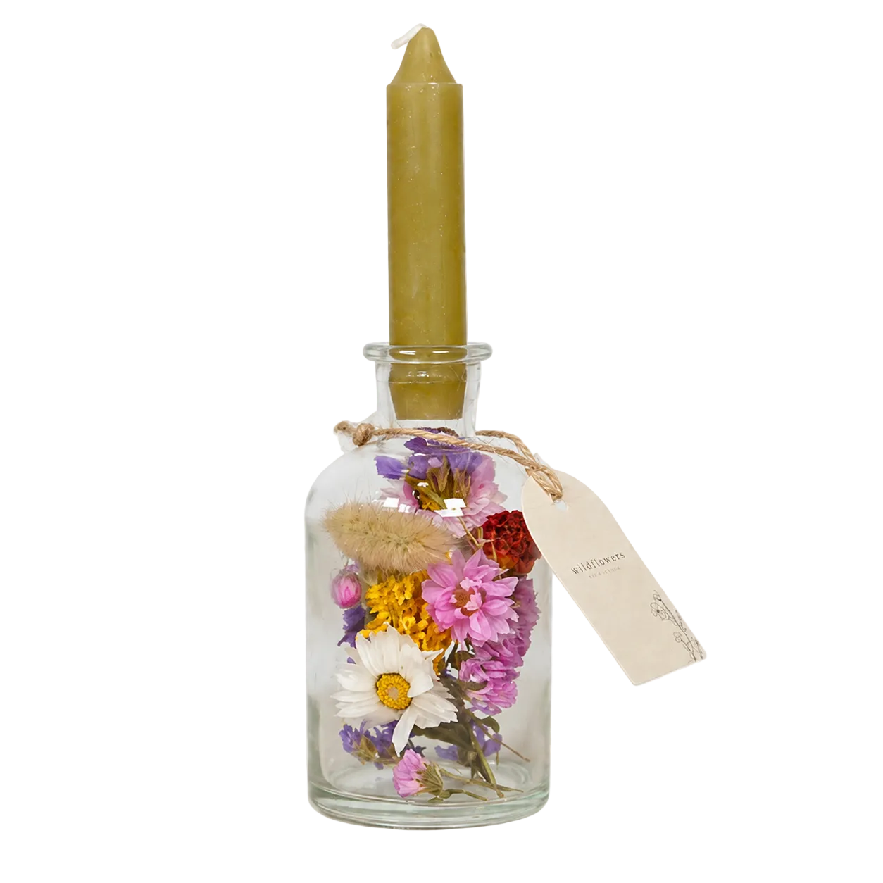 Glass bottle with dried flowers and a lit candle on a white background