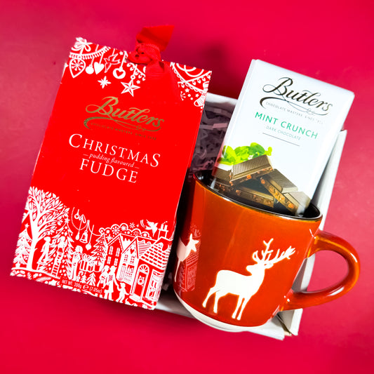 Sweet Season Christmas gift box featuring Butlers Christmas Pudding Fudge, Mint Crunch chocolate, and a red reindeer mug, festive Irish gift set from Care Box Collection