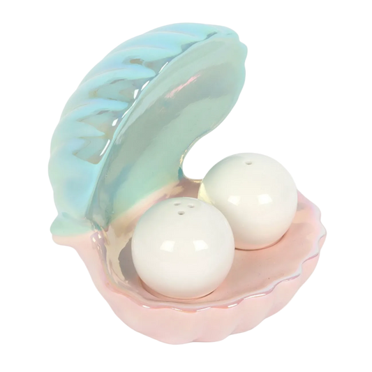 A pastel shell-shaped salt and pepper shaker holder with an iridescent finish, holding two white pearl-style ceramic shakers.