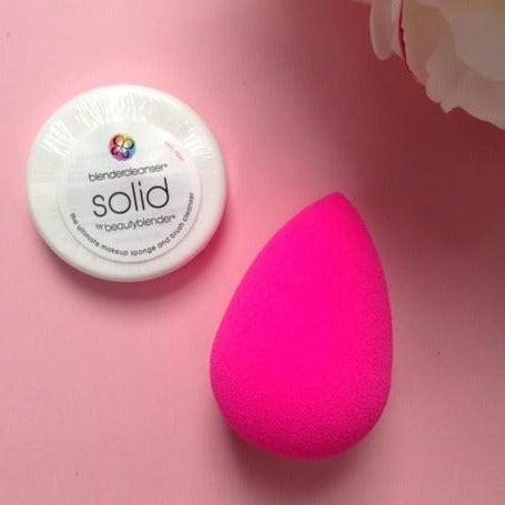 pink beauty blender with cleanser